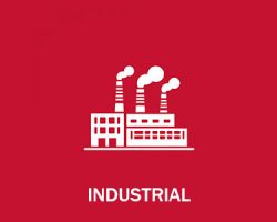 White factory icon with three smokestacks on a red background; the word "INDUSTRIAL" appears below the icon.